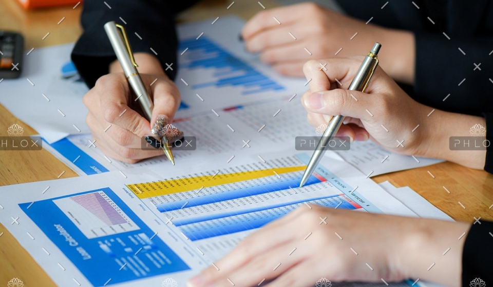 demo-attachment-489-female-office-staff-are-summarizing-the-number-in-6NXGYBK